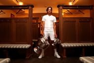 37-year-old wildcard Feliciano Lopez poses with his trophy haul: 2nd Queen's singles title and first doubles title won with Andy Murray